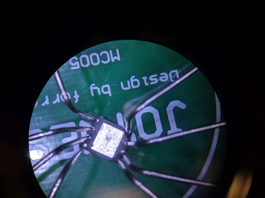using needles to connect to SPI flash chip - closeup